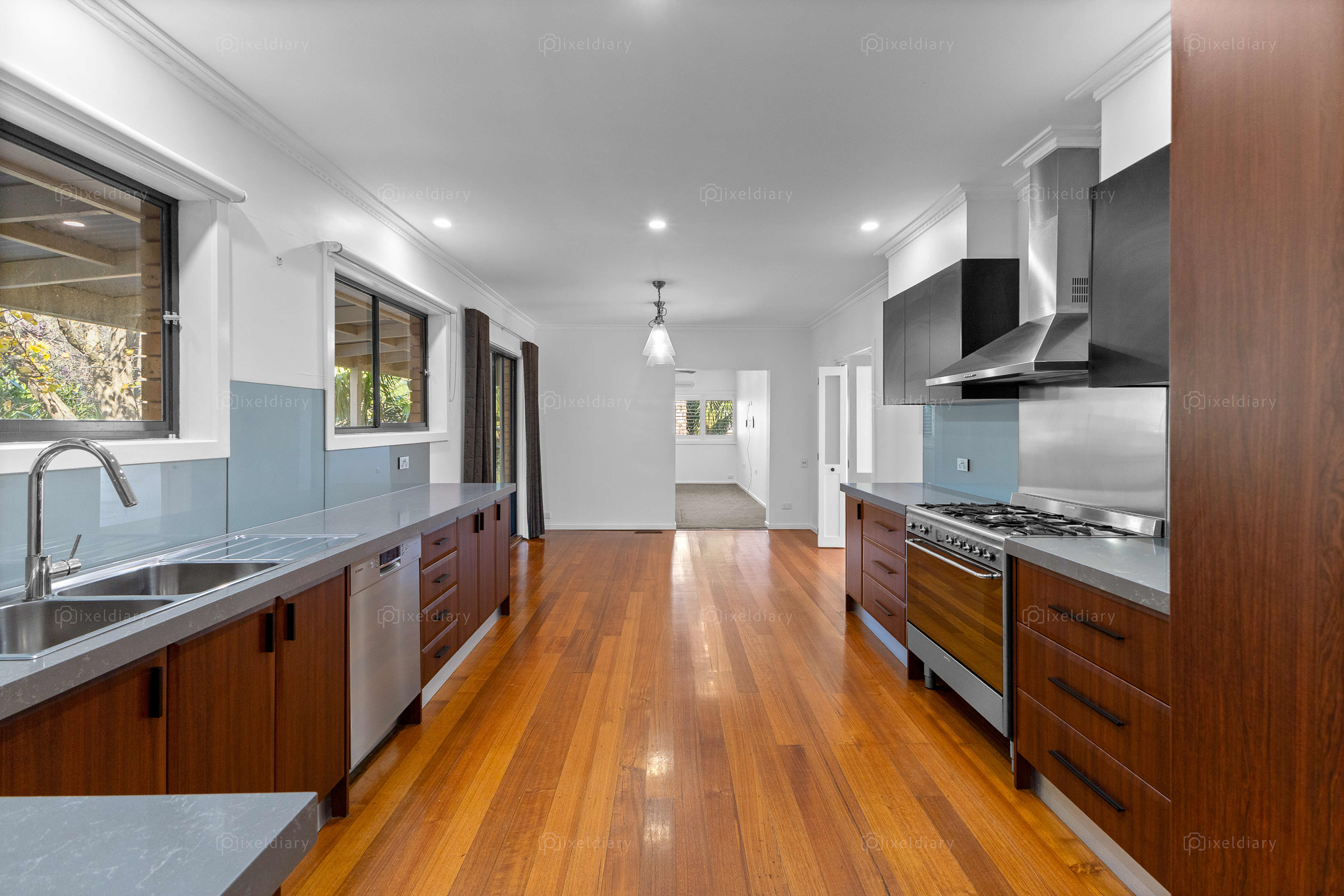 Timber kitchen photographed from a central perspective