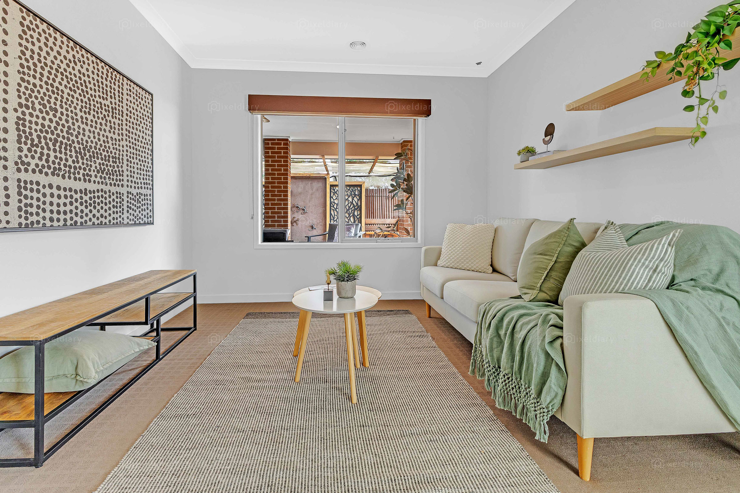 Styled living space with green accents