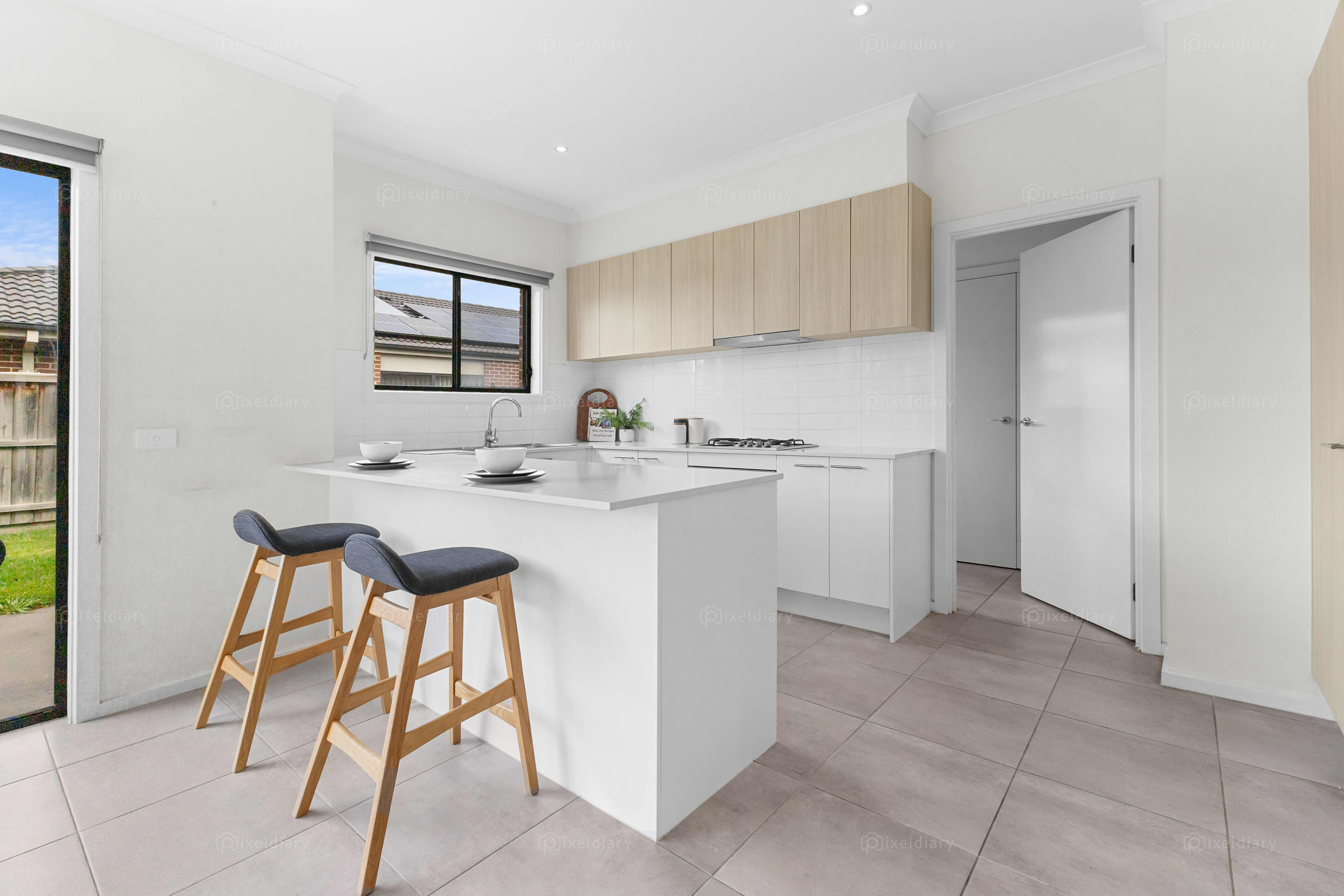 Bright kitchen with breakfast bar seating