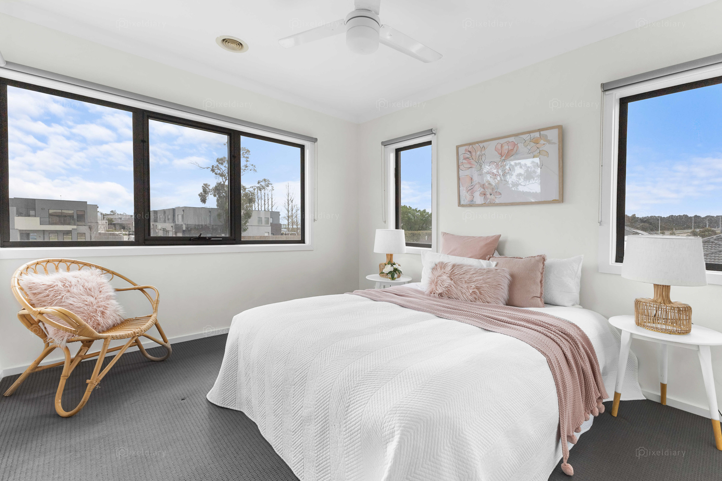 Sunlit bedroom with blush-toned styling